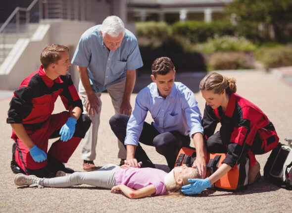 paramedics-examining-injured-girl-scaled